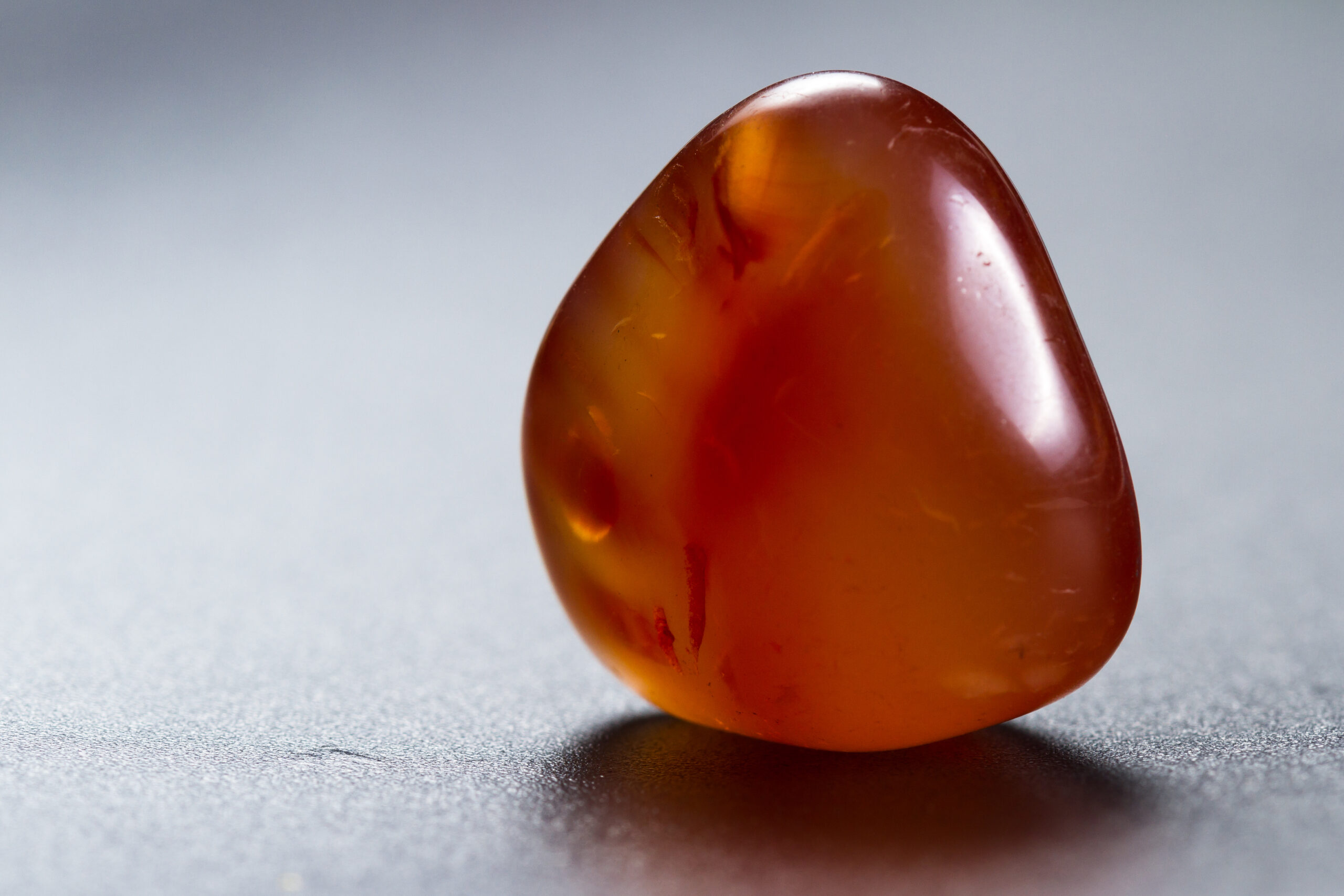 close-up-of-a-polished-piece-of-carnelian-isolated-2025-10-28-21-38-26-utc